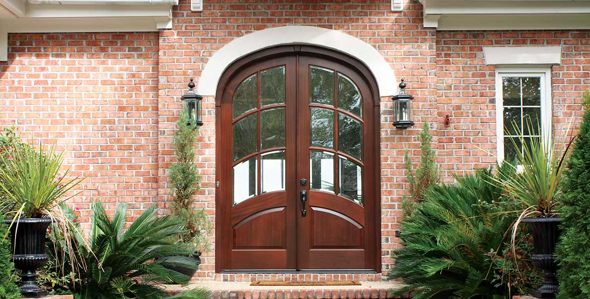 Traditional style arched top double entry front doors w/ 6 beveled glass curved panels, Mahogany, Aberdeen custom collection